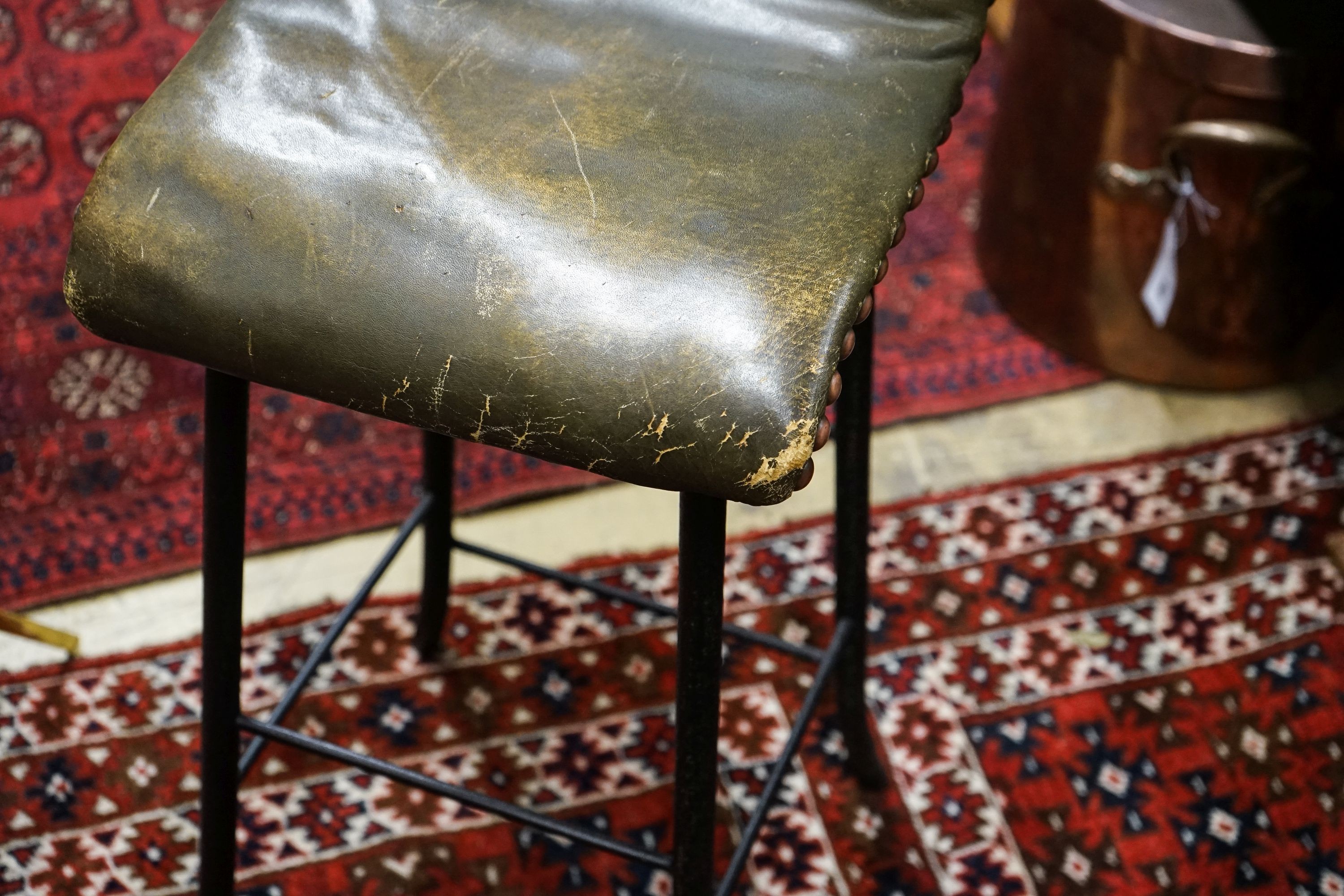 An Edwardian brass music stand and stool